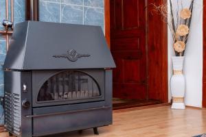 a stove in a room next to a door at FoRest Apartment  +33 photos