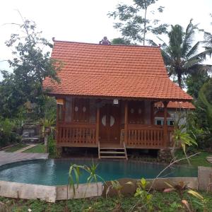 a house with a pool in front of it at Green vanilla Suite 2 in Silebeng
