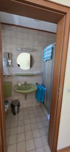a bathroom with a green sink and a toilet at Hotel - Pension Wendland in Wintrich +21 photos