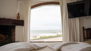 Кровать или кровати в номере Brisas Hosteria +121 фотография