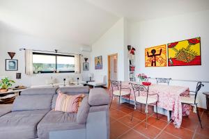 a living room with a couch and a table at Villa Ada in Cozze