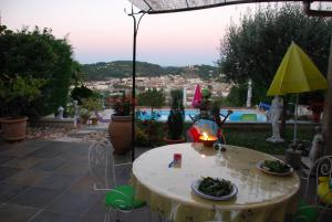 a patio with a table with plates of food on it at La Colombe in Vienne +30 photos