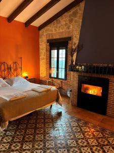 En eller flere senge i et værelse på El Encuentro - Casa Rural -