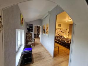 a room with an archway and a bed in a room at La Jinquette in Lantéfontaine +10 photos