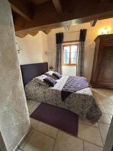 a bedroom with a bed and a window at Les Chènevottes au Hameau 1936 in Cherveux +27 photos