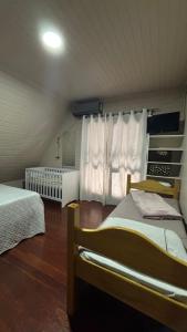 Ένα ή περισσότερα κρεβάτια σε δωμάτιο στο Hotel Pousada do Mel