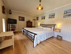 Ένα ή περισσότερα κρεβάτια σε δωμάτιο στο Au fil du temps 54