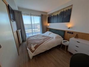 Postel nebo postele na pokoji v ubytování Juracîmes Appartements