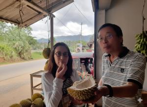 a man and a woman eating a piece of cake at Hotel Galaxy in Minneriya