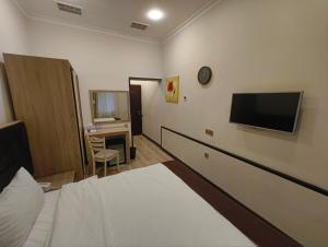 Et tv og/eller underholdning på Deluxe Hotel by Zorge street