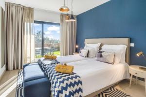 En eller flere senge i et værelse på Quinta do Algarvio Village