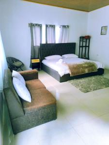 Ένα ή περισσότερα κρεβάτια σε δωμάτιο στο Monstera Forest Lodge +51 φωτογραφίες