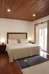 Кровать или кровати в номере Pekoe Bangalow Bambarakanda