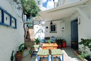 a small patio with a table and chairs at Casa Lola in Benaocaz