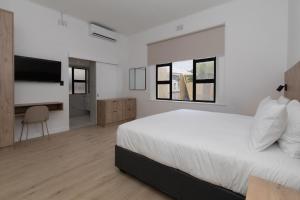 Ένα ή περισσότερα κρεβάτια σε δωμάτιο στο Elsewhere