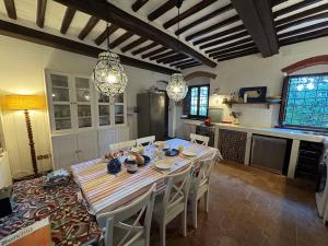 a dining room with a table and chairs in a kitchen at Allo Scoiattolo in Lucca