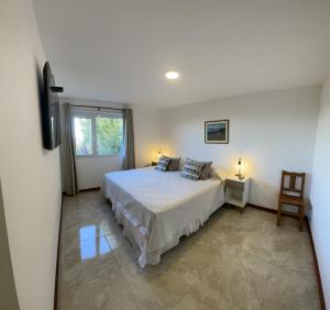 Ένα ή περισσότερα κρεβάτια σε δωμάτιο στο Altos de Manantiales