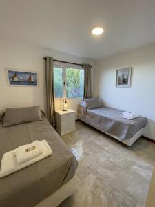 Ένα ή περισσότερα κρεβάτια σε δωμάτιο στο Altos de Manantiales