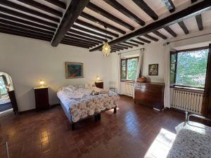 a bedroom with a bed and a table in it at Allo Scoiattolo in Lucca +52 photos