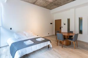 Ένα ή περισσότερα κρεβάτια σε δωμάτιο στο Araucarias Apartamentos +17 φωτογραφίες