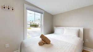 En eller flere senge i et værelse på Nautical View