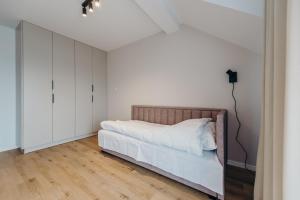 Postel nebo postele na pokoji v ubytování Apartamenty Zaczernie