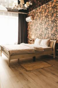 Postel nebo postele na pokoji v ubytování Cosmic апартаменти з ванною