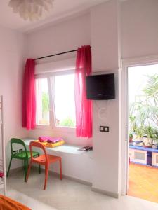 Telewizja i/lub zestaw kina domowego w obiekcie B&B Casa Alfareria 59