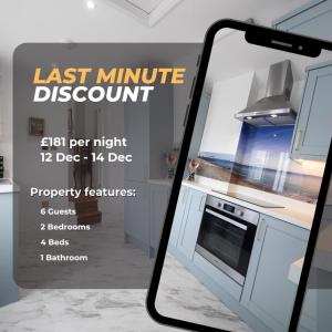 an iphone taking a picture of a kitchen at Luxury 2 Bedroom Georgian home, hot tub, sea view, private garden, sleeps 6 in Bognor Regis