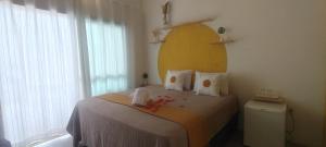 Postel nebo postele na pokoji v ubytování Cris Beach House