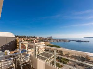 a balcony with a view of the ocean at Vue Mer - Neuf - Centre Ste Maxime in Sainte-Maxime