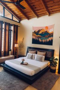 a bedroom with a large bed in a room at Meraki - Entire 3BHK Villa With Himalayan Views in Rānīkhet