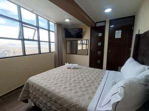 Postel nebo postele na pokoji v ubytování Kapricho Wanka