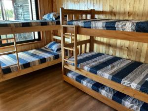 Ένα ή περισσότερα κρεβάτια σε δωμάτιο στο Chiloé,Curaco de Velez casa de veraneo +28 φωτογραφίες