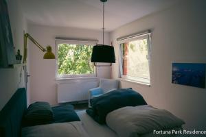 Ένα ή περισσότερα κρεβάτια σε δωμάτιο στο Fortuna Park Residence & Private Parking +27 φωτογραφίες