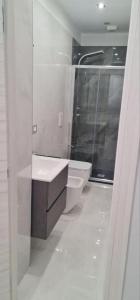 a bathroom with a toilet and a sink and a shower at B&B Grifondoro in Crotone +14 photos