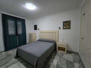 En eller flere senge i et værelse på Bahia de Santiago