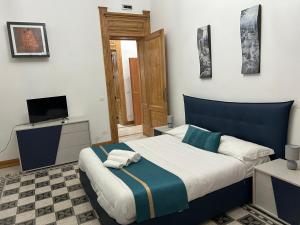 Ένα ή περισσότερα κρεβάτια σε δωμάτιο στο Maison Dominique