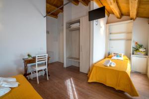 Ένα ή περισσότερα κρεβάτια σε δωμάτιο στο Enoturismo Le Rampe