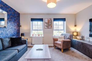 Et opholdsområde på Spacious 3 bedroom home with garden