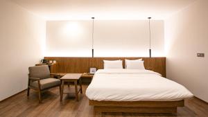 Postel nebo postele na pokoji v ubytování Hotel Yimok