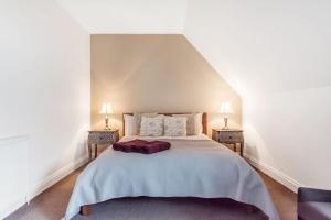 Ένα ή περισσότερα κρεβάτια σε δωμάτιο στο The Loft