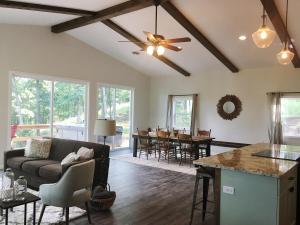 a living room with a couch and a table at Camp Carter Bunkhouse in Mathias