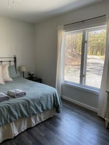 Giường trong phòng chung tại Camp Carter Bunkhouse