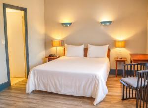 Ένα ή περισσότερα κρεβάτια σε δωμάτιο στο Hôtel Terminus