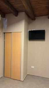 Et tv og/eller underholdning på El Atardecer Departamentos + 16 billeder