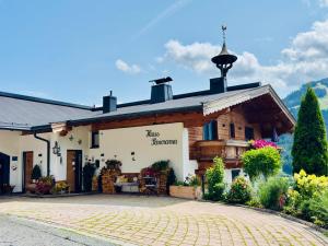 a building with a sign that reads inn st moritz at Haus Panorama in Brixen im Thale