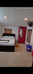 Una cama o camas en una habitación de Heritage Homestay staying guests for all functions