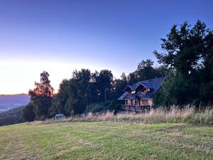 a house on top of a hill in a field at Berry in Klatovy +19 photos