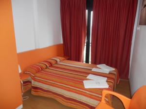 Postel nebo postele na pokoji v ubytování Apartamentos Bahía de Boó